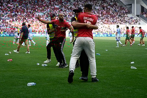 Stewards catch pitch invaders